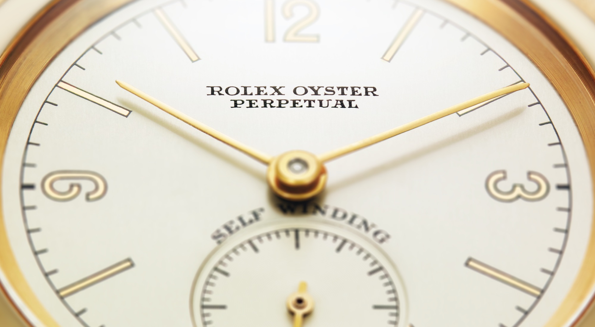 Close-up of Rolex dial with gold hands