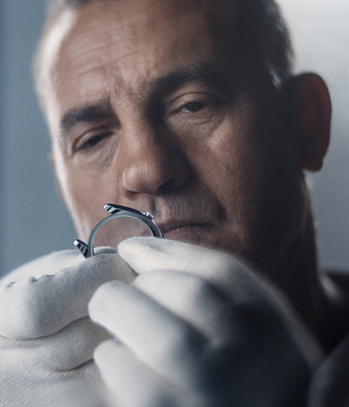 Rolex craftsman inspecting a watch case